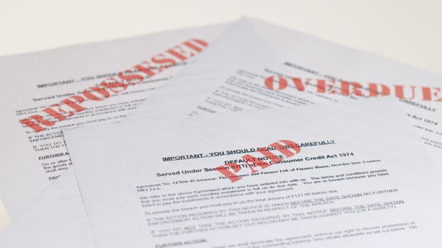 stack of mail collection notices; how to file a complaint against a debt collection agency