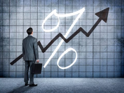 A businessman considers what a fed rate hike might mean for him