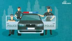 3 officers on patrol, one wearing a price tagged mortarboard – a candidate for student loan forgiveness for police officers