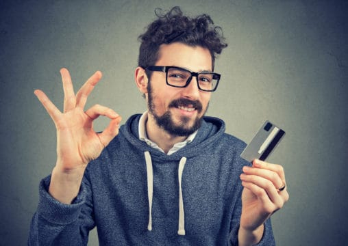 young man with credit card