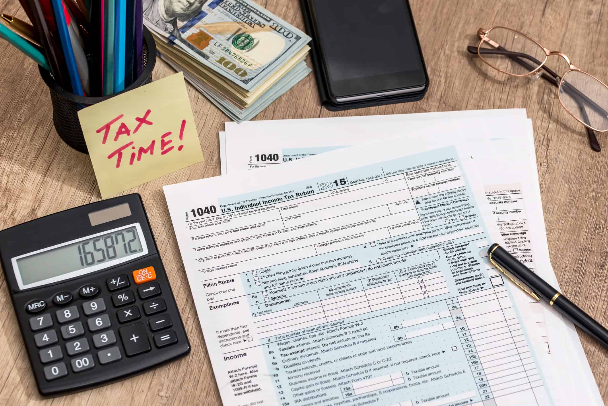 Calculator, 1040 paperwork and other tax filing tools