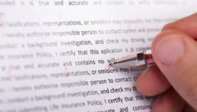 Person's Hand Marking Error During Spellchecking Text