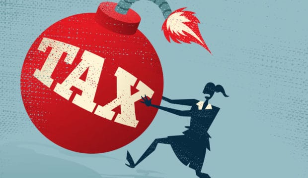 Abstract Businesswoman with Huge Tax Bomb