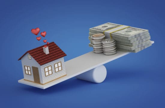 home equity line of credit; house balancing with money on a plank