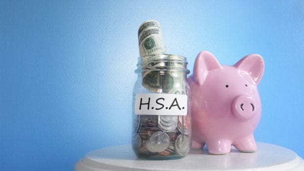 Health Savings Account ( HSA ) coin jar with piggy bank