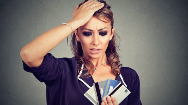 Woman learns her credit card account has been charged-off. She's worried about the damage it'll have on her credit.