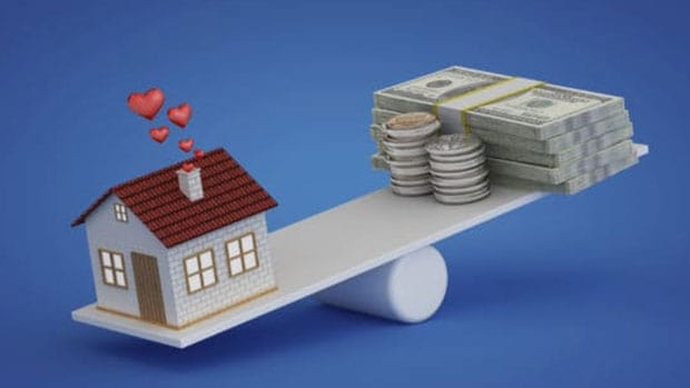 home equity line of credit; house balancing with money on a plank