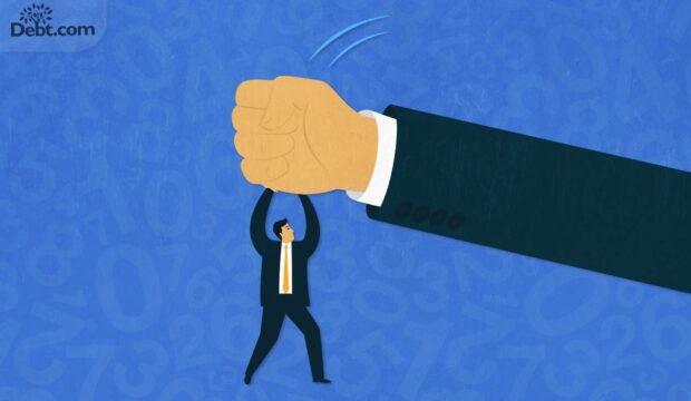 A small man pushing a large fist up and away. Are you being harrassed by a debt collector?
