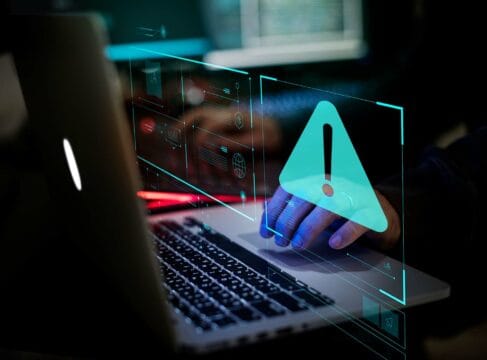 Fraud alert notification seen through graphic display on a laptop