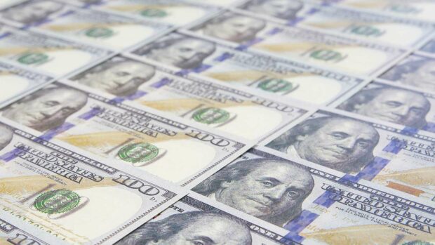 A lot of Money background. Dollars currency notes. Inflation rate.