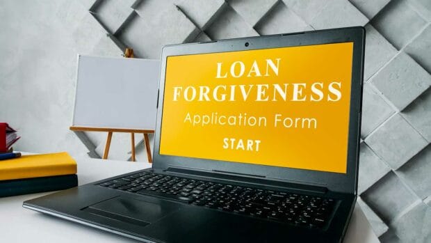 Laptop and open application for loan forgiveness.