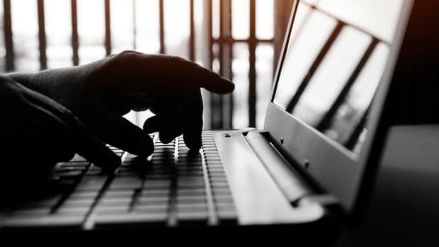 Cyber crime attack on bank, cybercrime reaching through laptop computer