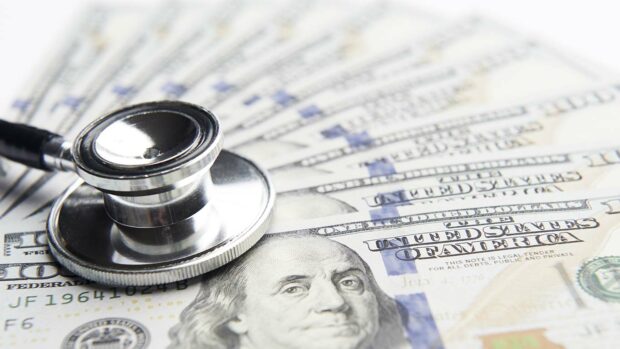 Stethoscope on a stack of money