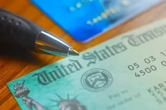 Image showing a pen over a check from the United States Treasury for Social Security income and the cost-of-living adjustment