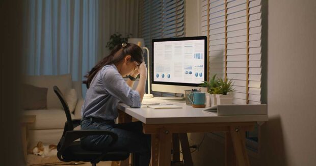 young woman stressing over her bills
